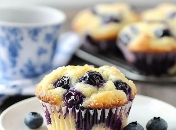 Blueberry Cream Cheese Muffins with fresh blueberries and cream cheese topping