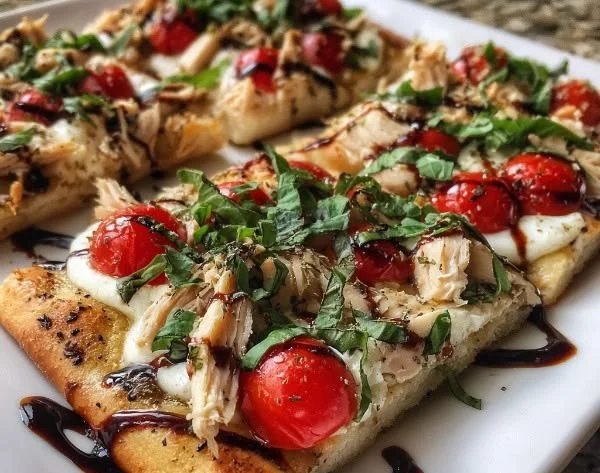 Delicious Caprese Chicken Flatbread topped with fresh basil and mozzarella