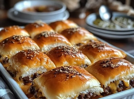 Delicious cheeseburger sliders served on Hawaiian rolls with toppings.