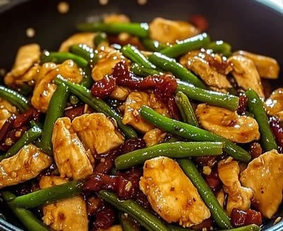 Delicious chicken and green bean stir-fry on a plate
