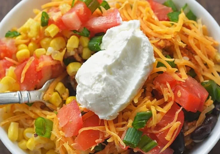 Healthy Chicken Burrito Bowls for Weight Watchers topped with fresh ingredients