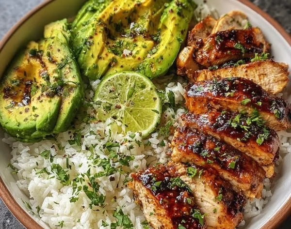 Delicious Honey Lime Chicken served over Avocado Rice Bowl.