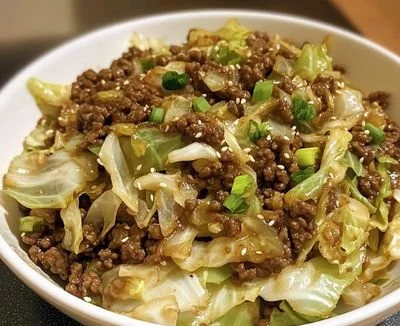 Plate of low-carb Mongolian ground beef with cabbage and vegetables