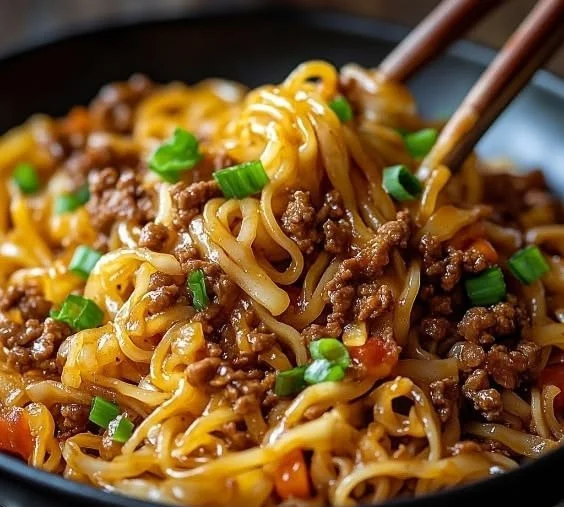 Mongolian Ground Beef Noodles served in a bowl with vegetables