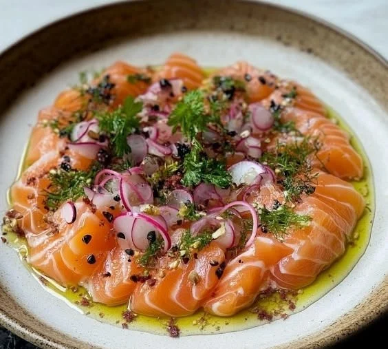 Delicious Salmon Crudo dish showcasing fresh raw salmon with vibrant garnishes