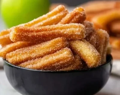 Crispy air fryer apple fries served in a bowl