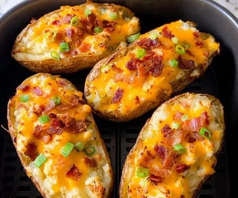 Air Fryer Twice Baked Potatoes with toppings on a plate