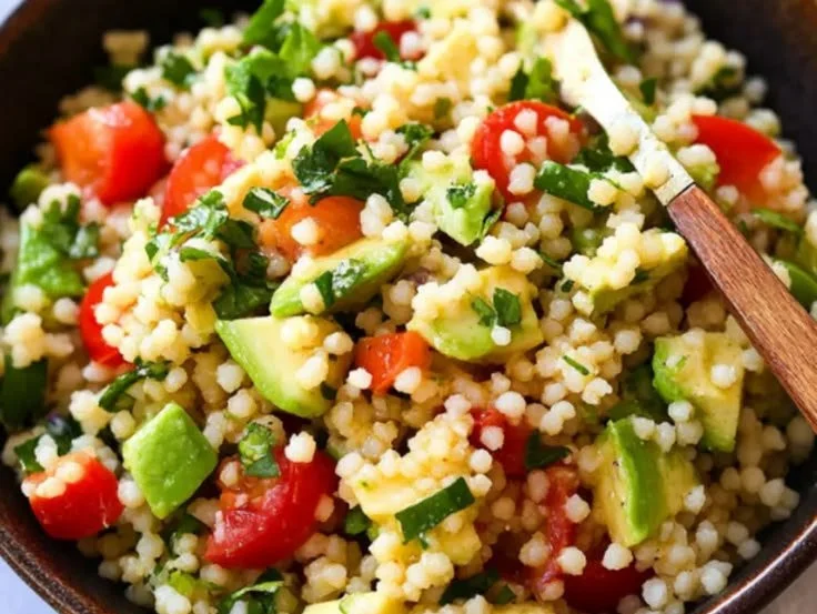 Avocado Couscous Salad with Lime Vinaigrette served in a bowl