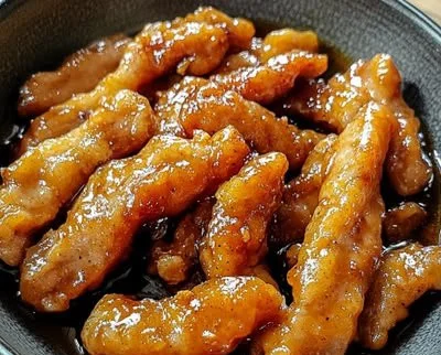 Delicious sweet and sour pork served with colorful vegetables