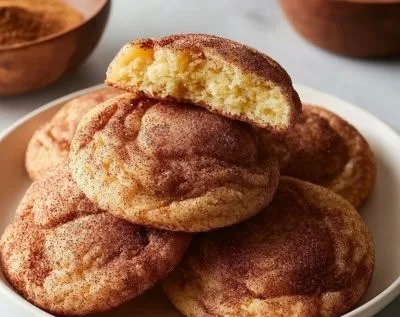 Delicious homemade Cinnamon Snickerdoodle Cookies displayed on a plate.