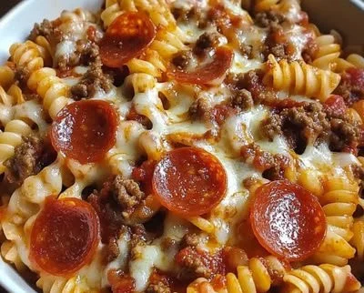 Crockpot pizza pasta dish served for a gathering