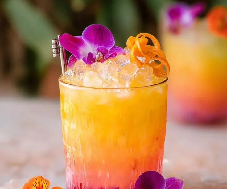Refreshing Pineapple Mango Rum Punch in a tropical setting for summer parties