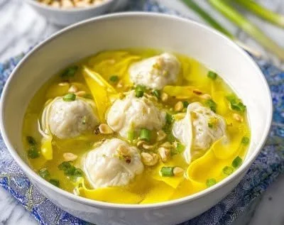 Bowl of Wonton Egg Drop Soup garnished with green onions